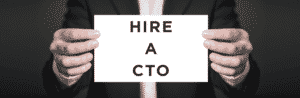 man holding a card that says hire a cto